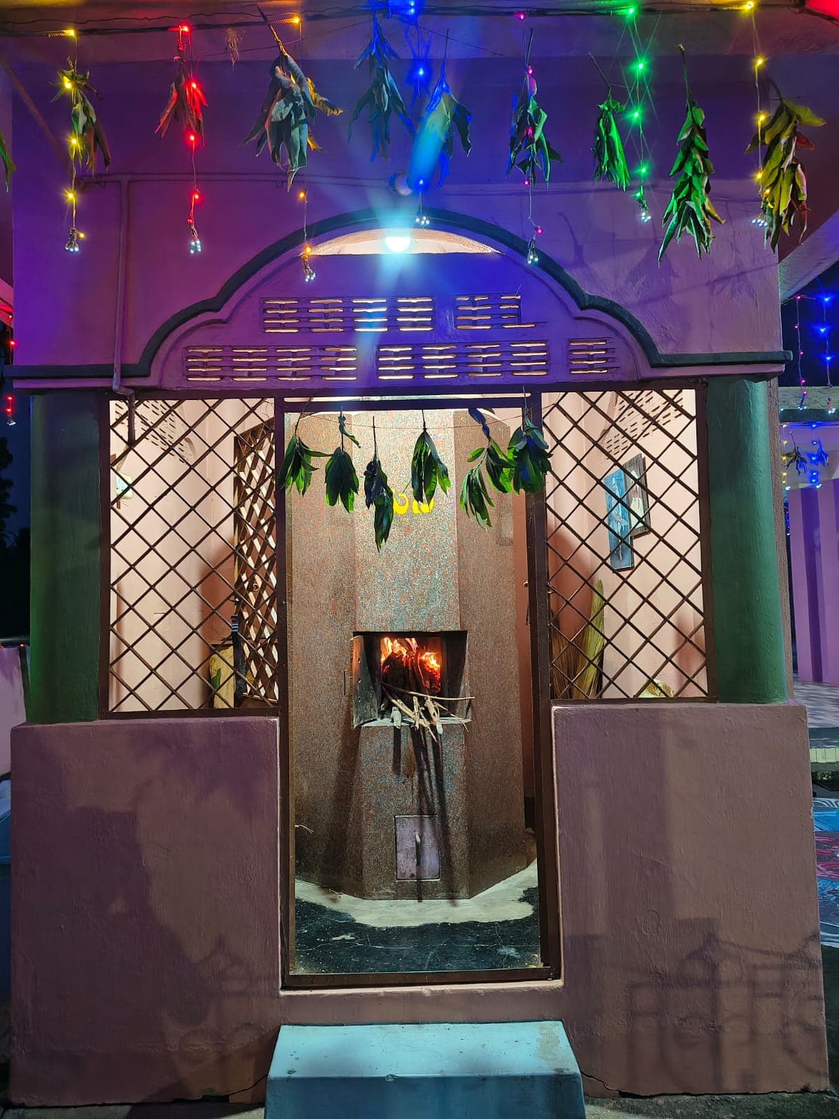The temple's dhuni, the sacred fire kept burning since consecration
